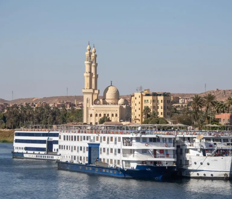 Christmas Nile cruise overlooking Luxor temples and a traditional felucca at sunset