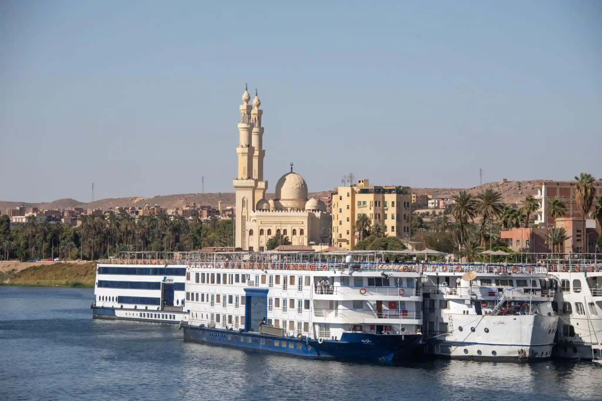 Christmas Nile cruise overlooking Luxor temples and a traditional felucca at sunset